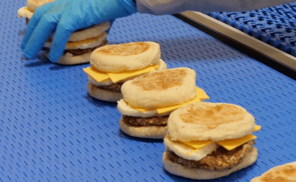 Capitol Kitchen breakfast sandwiches on conveyor